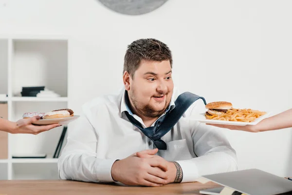 Overweight Businessman Choosing Donuts Hamburger French Fries Lunch — Stock Photo, Image