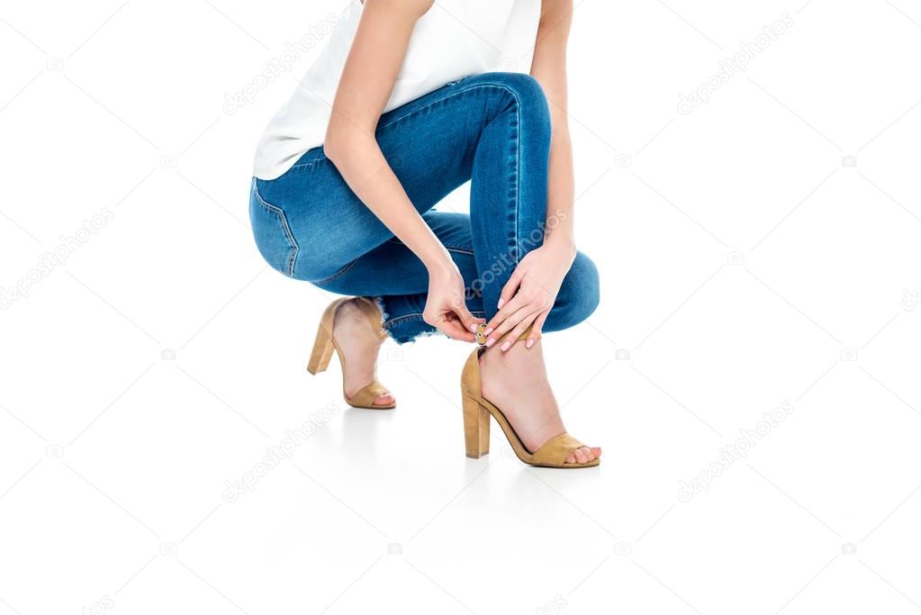 cropped view of stylish woman wearing heels, isolated on white
