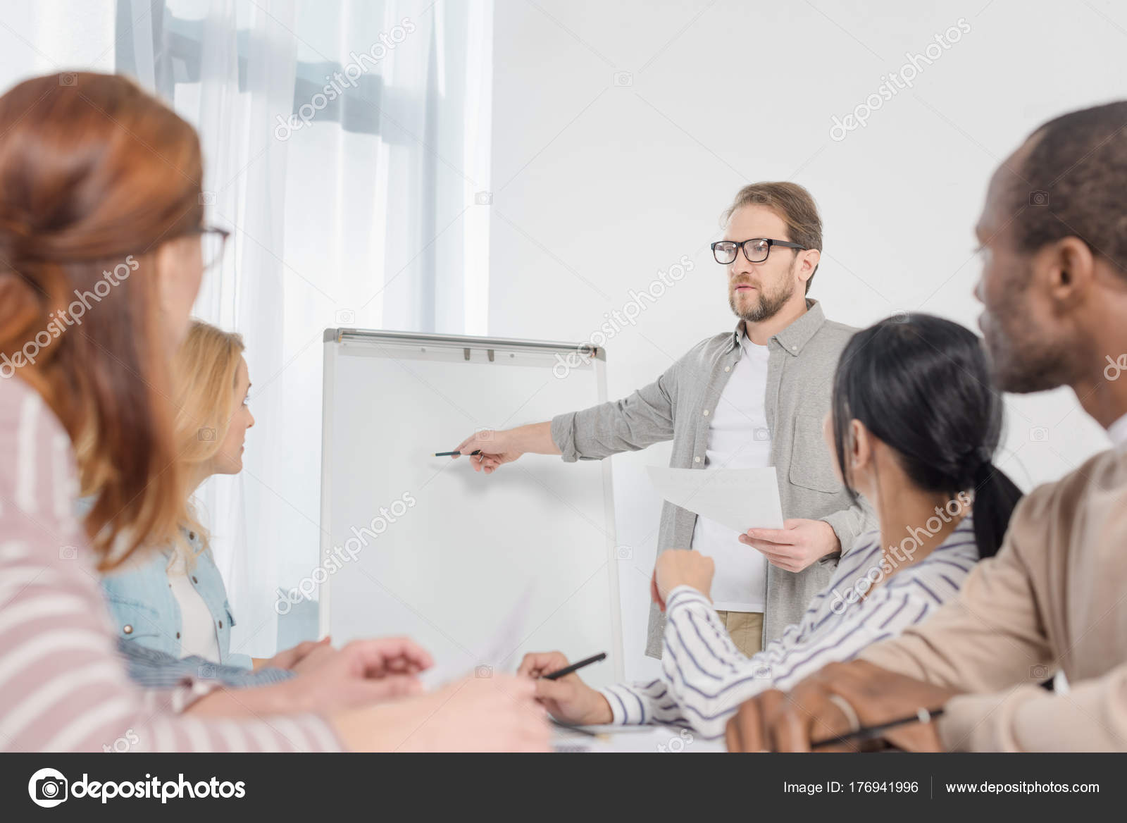 Male Psychoanalyst Pointing Whiteboard White People Gathered Table Anonymous  Group Stock Photo by ©IgorVetushko 176941996