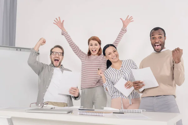 Excited Multiethnic Middle Aged People Holding Papers Triumphing — Stock Photo, Image