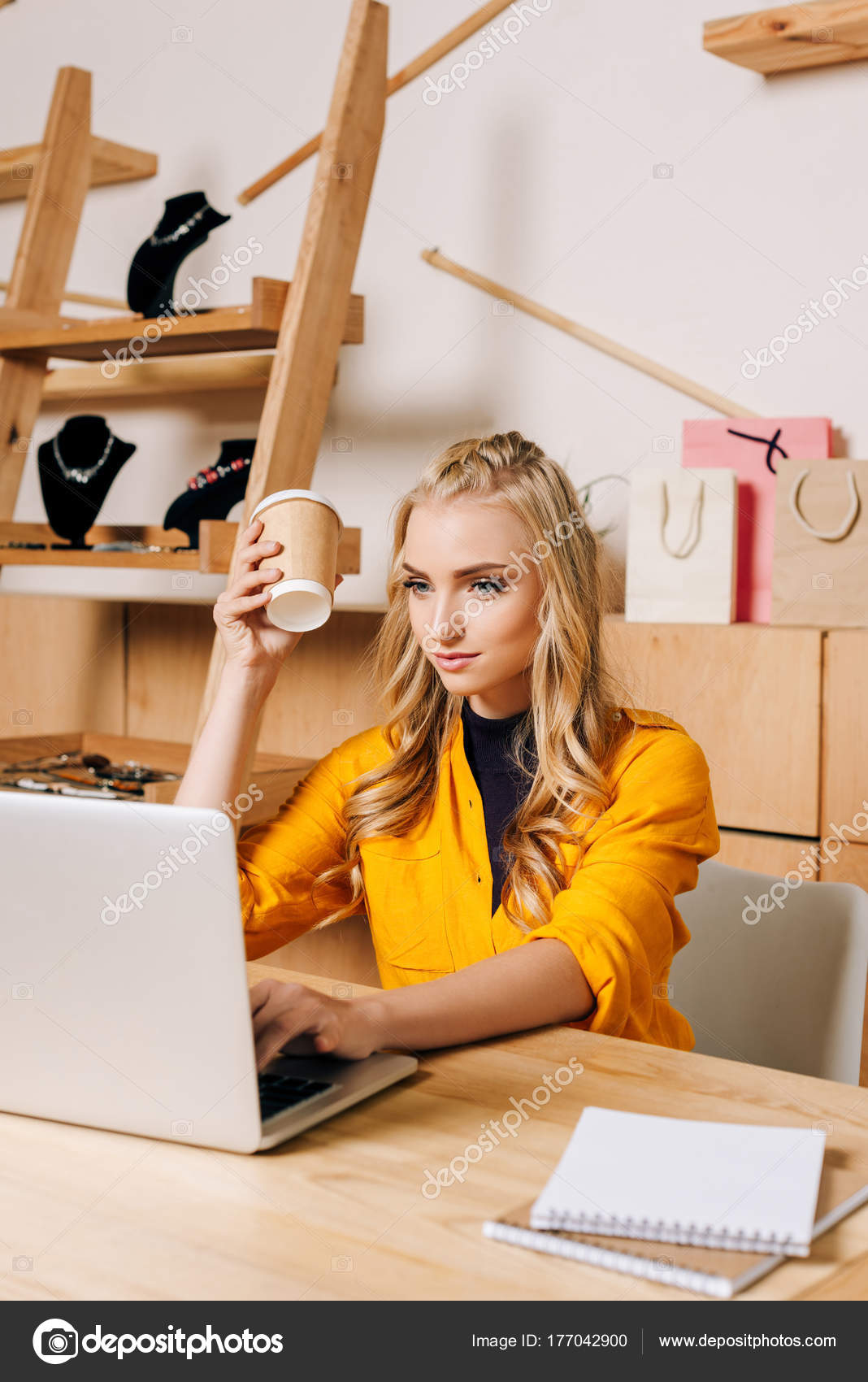 Clothing Store Manager Coffee Working Laptop Free Stock Photo