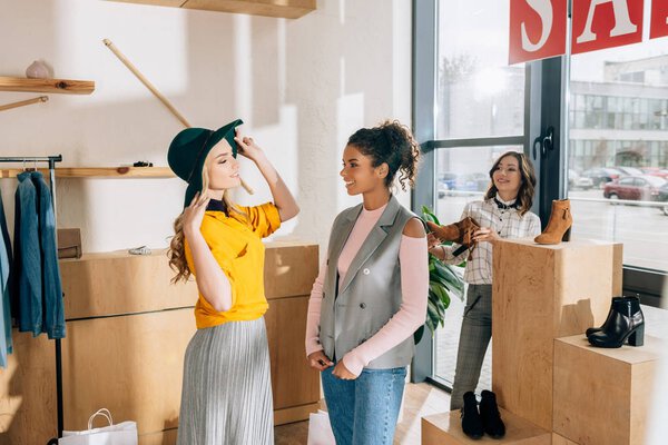 group of young women on shopping in clothing store