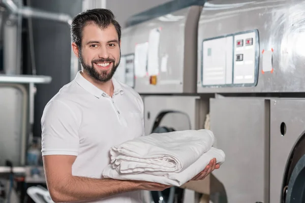 Happy Dry Cleaning Worker Holding Stack Clean Clothes — Stock Photo, Image
