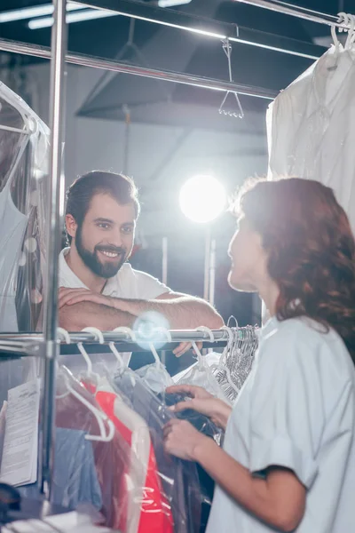 Young Dry Cleaning Workers Talking Warehouse — Stock Photo, Image