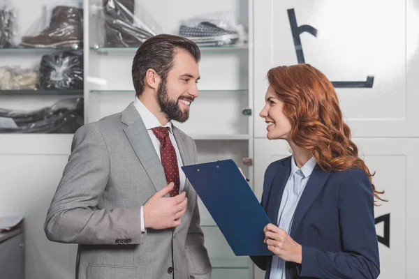 Beautiful Dry Cleaning Manageress Writing Order Handsome Young Man — Stock Photo, Image