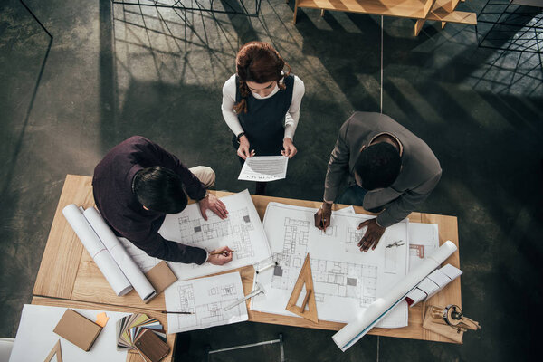 high angle view of team of architects working at office