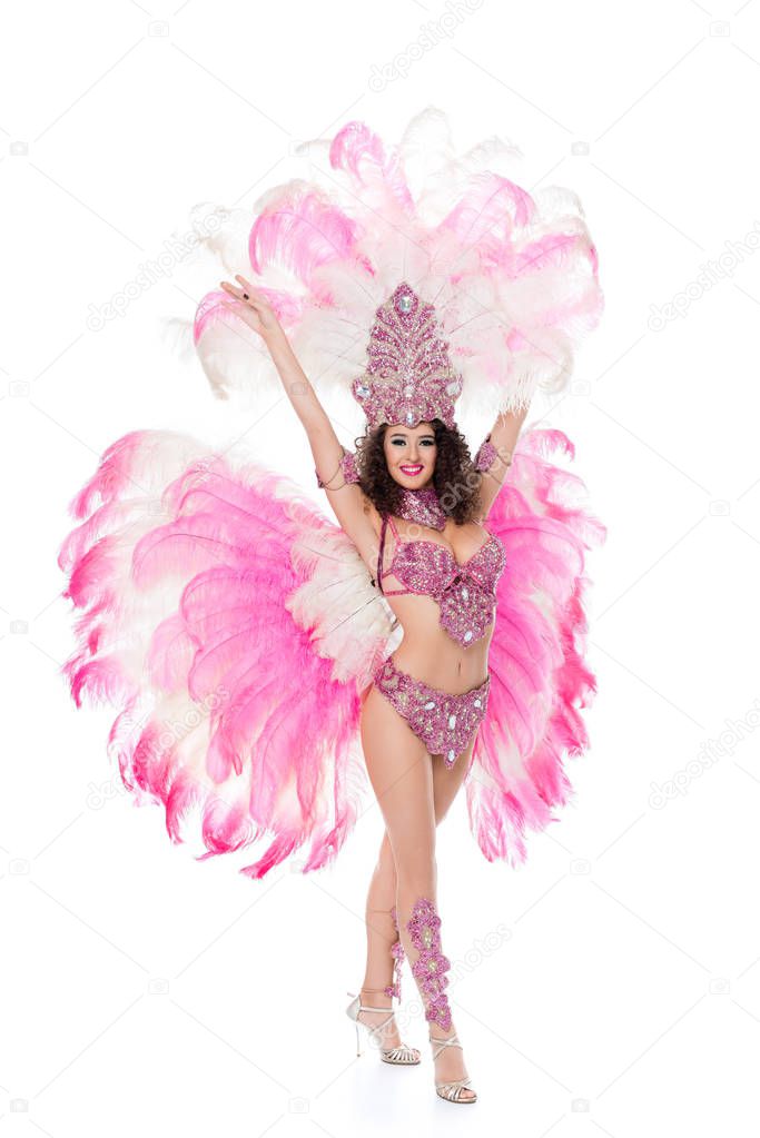 beautiful woman dancing in carnival costume with pink feathers, isolated on white