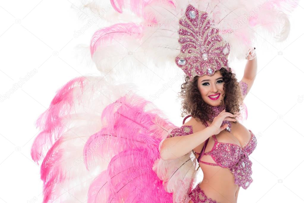 attractive girl posing in carnival costume with pink feathers, isolated on white
