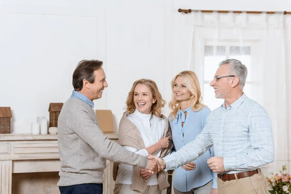 Senior Man Woman Greeting Friends Guests Shaking Hands — Stock Photo, Image