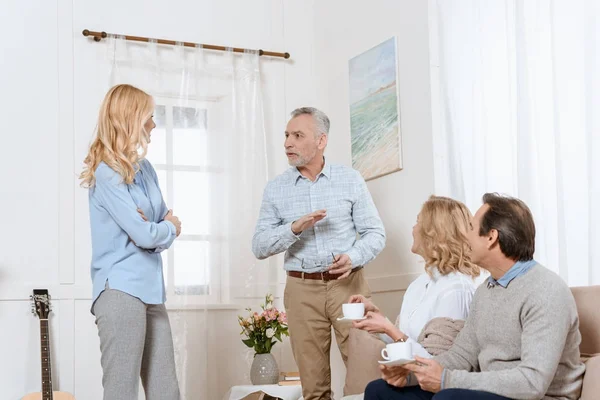 Middle Aged Men Women Having Conversation While Drinking Tea Sofa — Stock Photo, Image