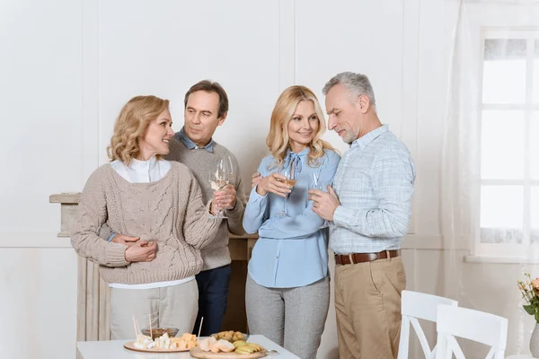 Happy Friends Cheering While Standing Table — Free Stock Photo