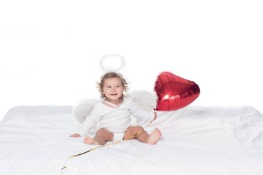 little angel with wings and nimbus holding red heart balloon, isolated on white clipart