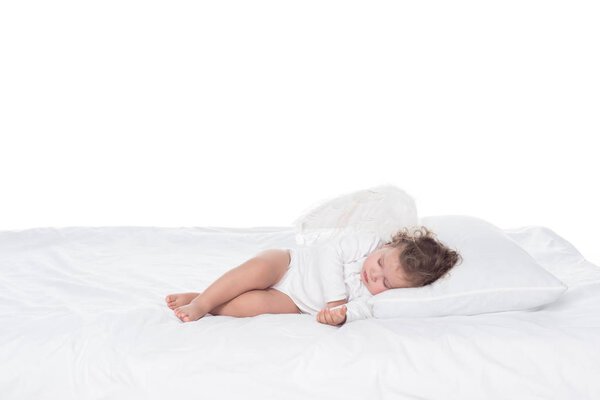 little baby angel sleeping on bed, isolated on white