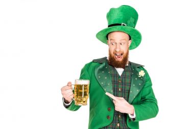 leprechaun pointing at glasses of beer, isolated on white