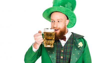 leprechaun celebrating st patricks day with beer, isolated on white