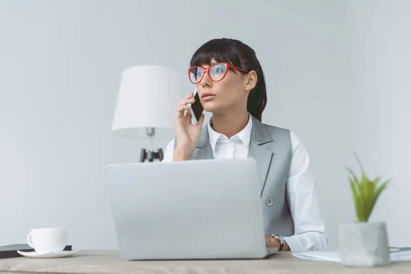 Businesswoman Talking Smartphone Using Laptop Isolated Gray — Stock Photo, Image