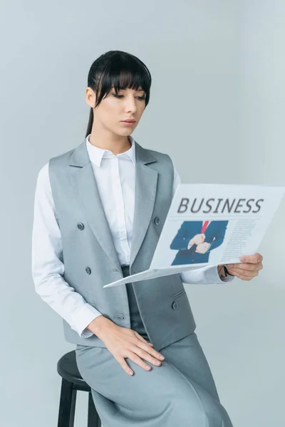 Businesswoman Sitting Chair Reading Business Newspaper Isolated Gray — Free Stock Photo