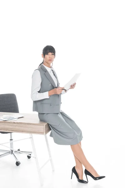 Businesswoman Leaning Table Holding Documents Isolated White — Free Stock Photo