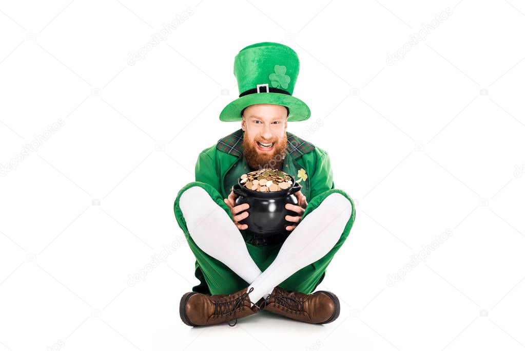 excited leprechaun in green suit holding pot of gold, isolated on white 