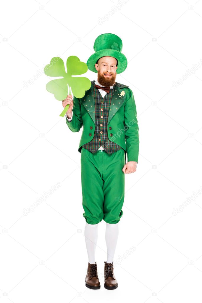 leprechaun in green suit holding clover, isolated on white