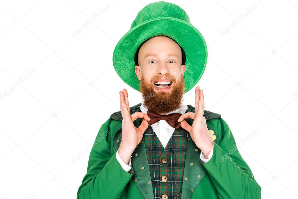 excited man in green leprechaun costume and bow tie, isolated on white