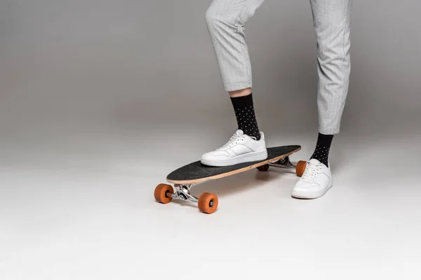 Low Section Stylish Man Standing Skateboard Grey — Stock Photo, Image