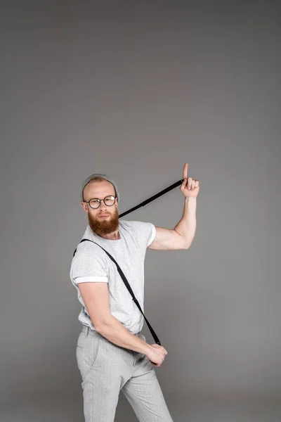 Stylish Bearded Man Playing Suspenders Looking Camera Isolated Grey — Stock Photo, Image