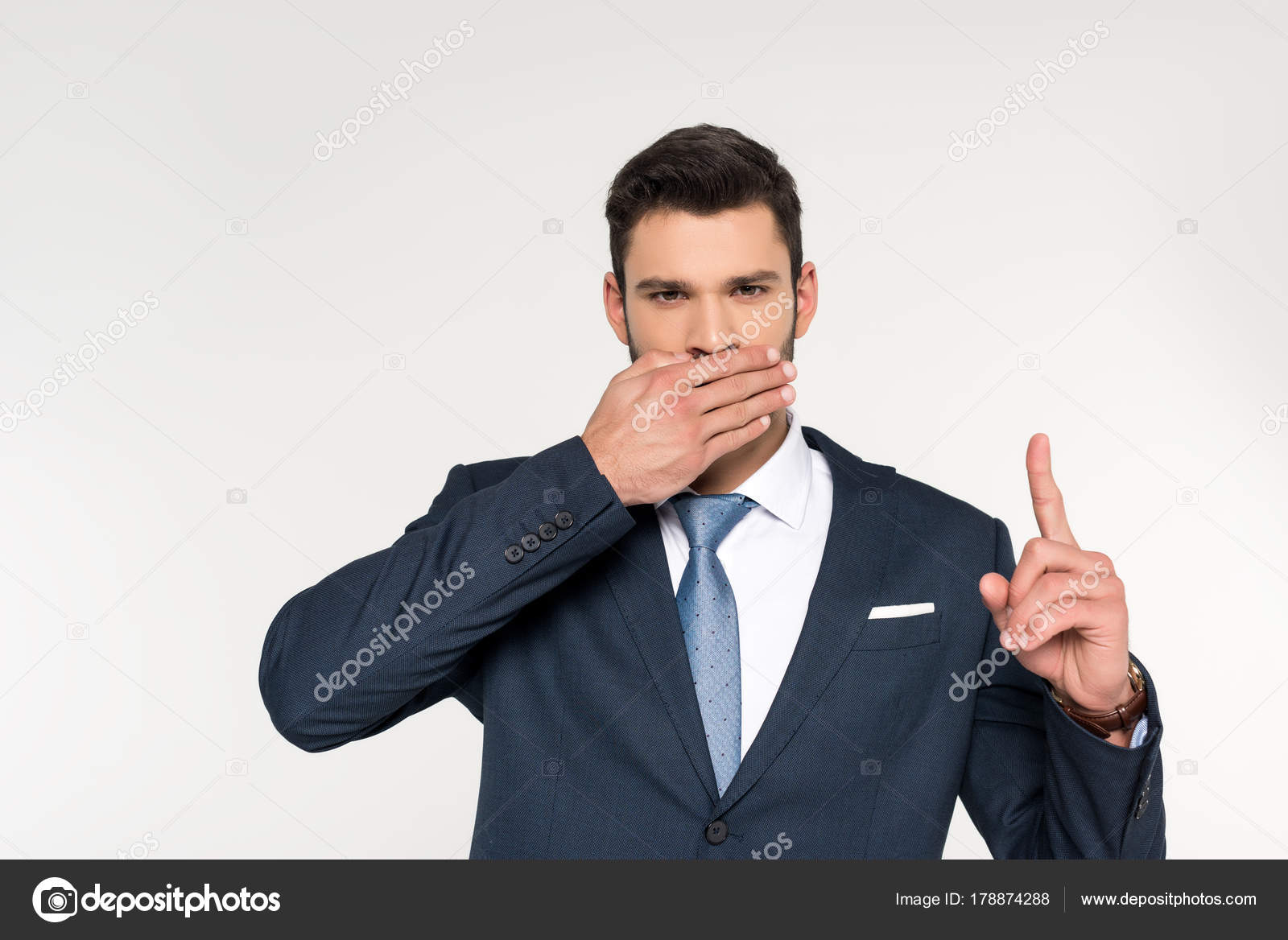 Young Businessman Closing Mouth Palm Pointing Finger Isolated Grey
