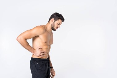 side view of shirtless young man with stomachache isolated on white clipart