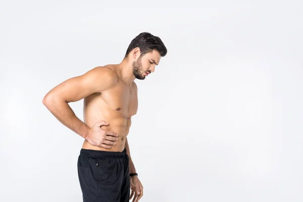 白で隔離の腹痛の上半身裸の若い男の側面図 — ストック写真