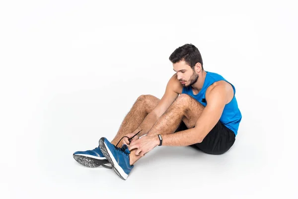 Sportive Young Man Lacing Sneakers Run White — Free Stock Photo