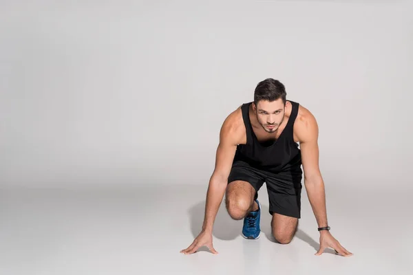 Handsome Young Runner Start Position White — Stock Photo, Image