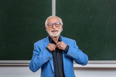 happy senior lecturer buttoning shirt clipart