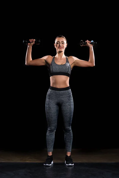 Athletic Sportswoman Holding Dumbbells Smiling Camera Black — Free Stock Photo