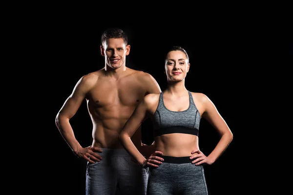 Sporty Young Couple Standing Together Smiling Camera Isolated Black — Stock Photo, Image