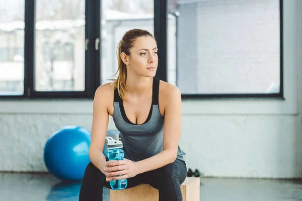 Portrait Pensive Sportswoman Water Bottle Looking Away Gym — Stock Photo, Image