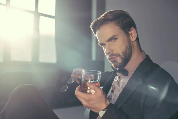 Stylish Young Man Holding Eyeglasses Glass Whisky Looking Camera — Stock Photo, Image
