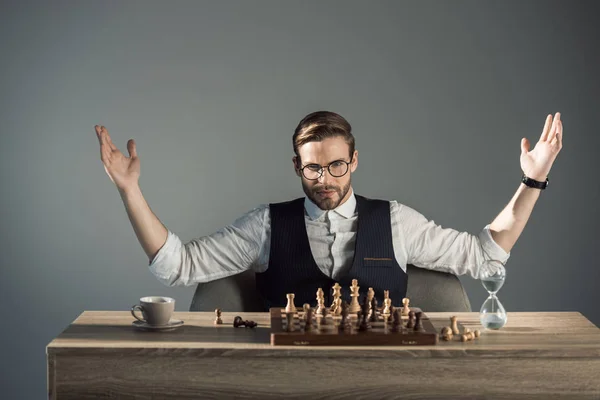 Triumphing Young Busnessman Eyeglasses Looking Camera While Playing Chess — Stock Photo, Image