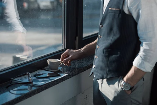 Mid Section Businessman Hand Pocket Drinking Coffee Window — Free Stock Photo