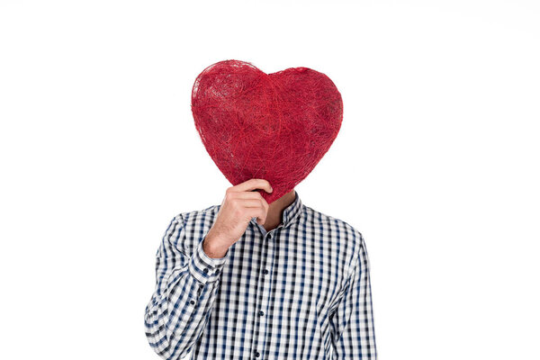 man covering face with heart of threads isolated on white, valentines day concept