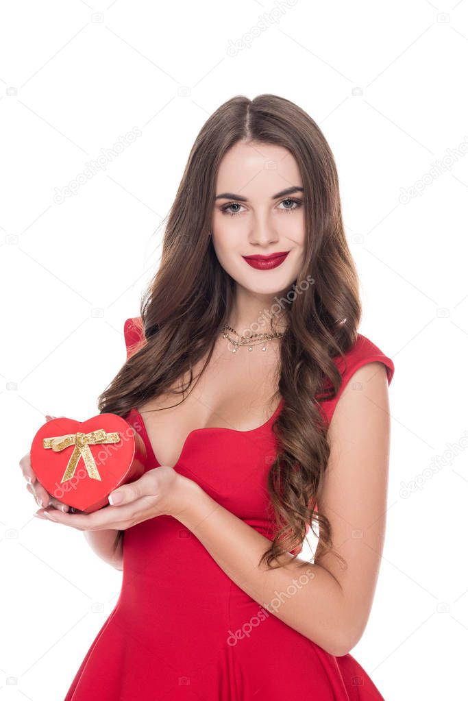 attractive girl in red dress holding present box isolated on white, valentines day concept