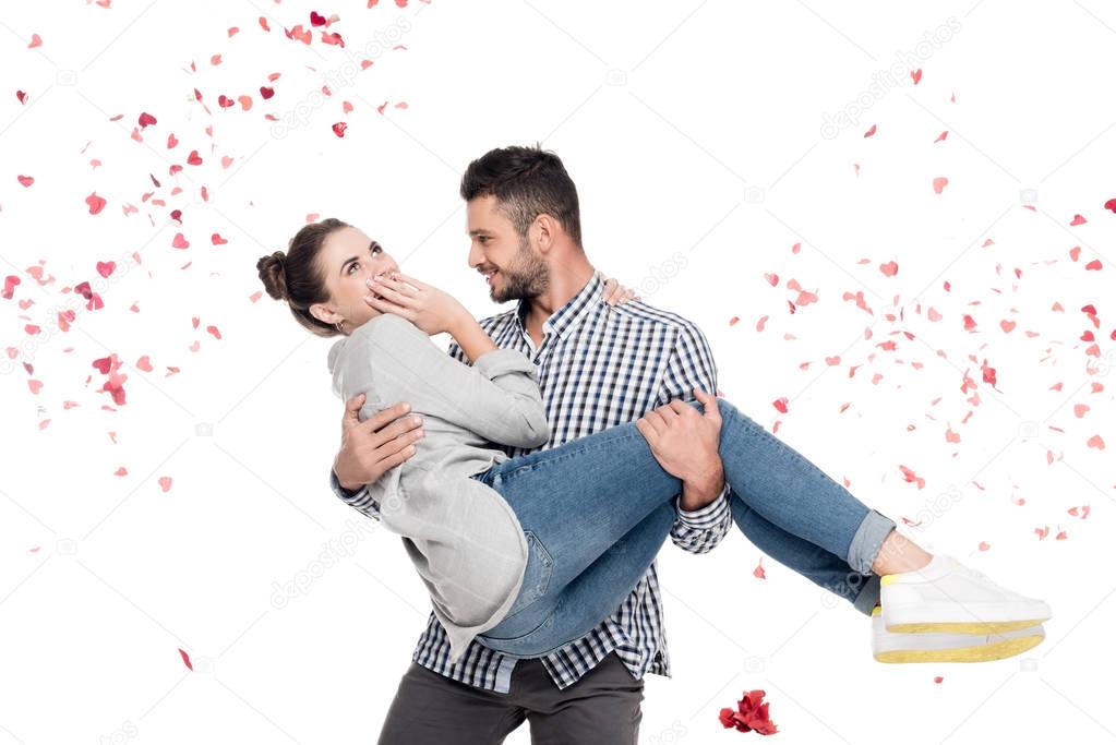 boyfriend carrying girlfriend isolated on white, valentines day concept