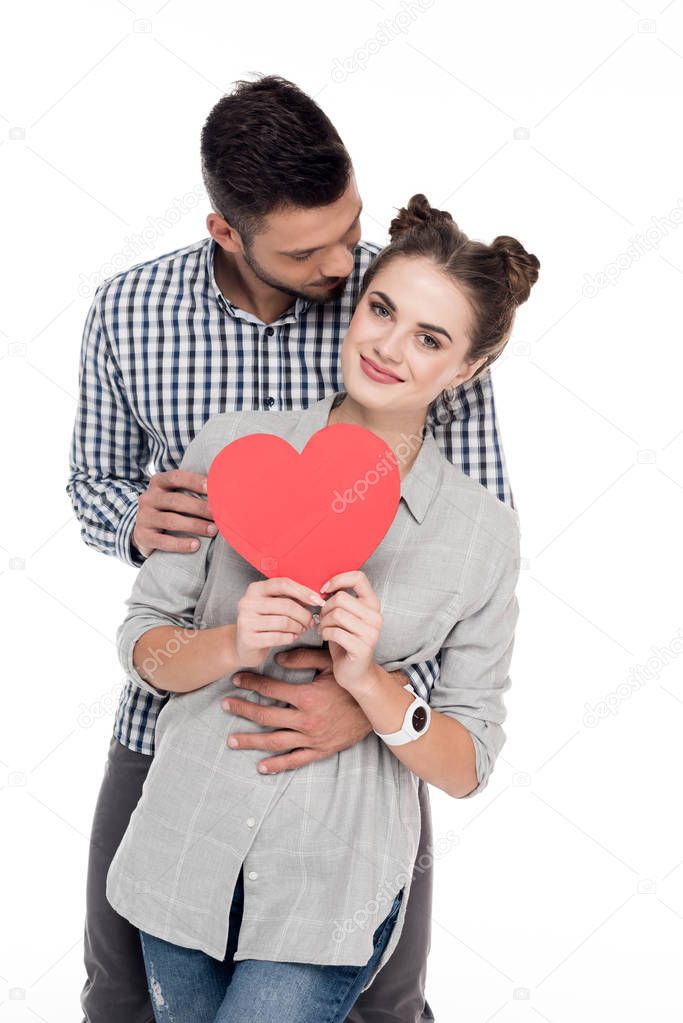 boyfriend hugging girlfriend with paper heart isolated on white, valentines day concept