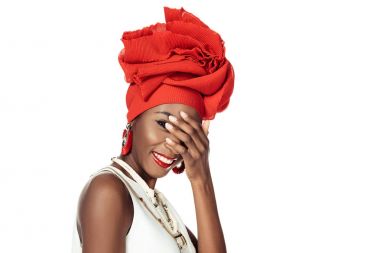 young african american woman in wire head wrap covering face with hand isolated on white clipart