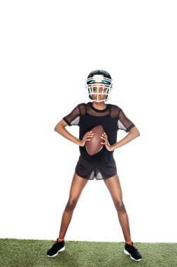 equiped female american football player standing on grass with ball isolated on white clipart