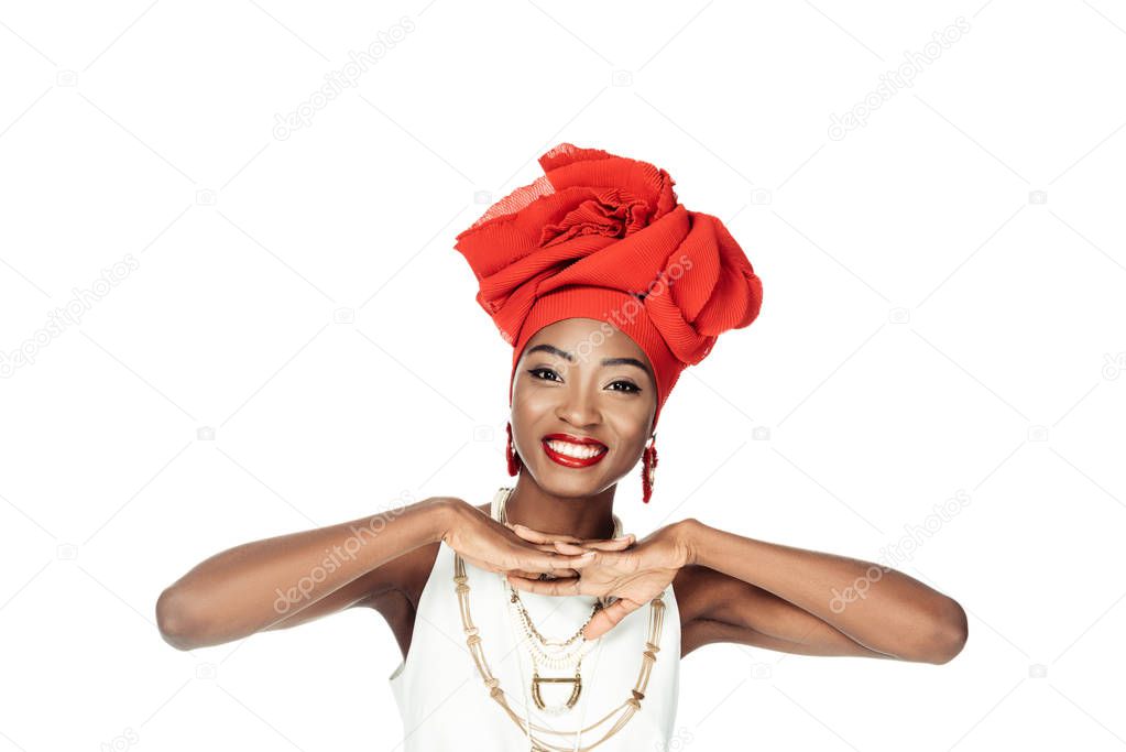 smiling african american woman in wire head wrap isolated on white