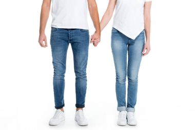 low section view of couple holding hands, isolated on white clipart