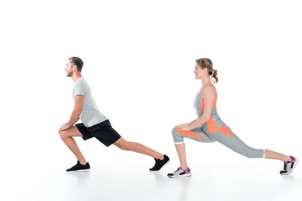 Vue Latérale Couple Sportif Échauffant Avant Entraînement Isolé Sur Blanc — Photo