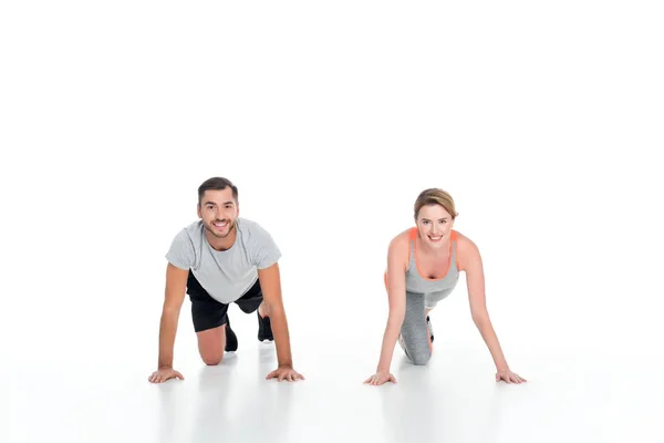 Smiling Sportive Couple Exercising Together Isolated White — Free Stock Photo