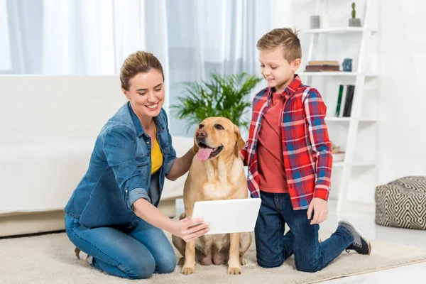 Mother Son Playing Console Games While Dog Sitting Floor — Free Stock Photo